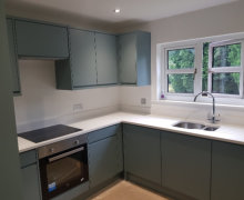 fjord green kitchen in Bramhall with white quartz worktops